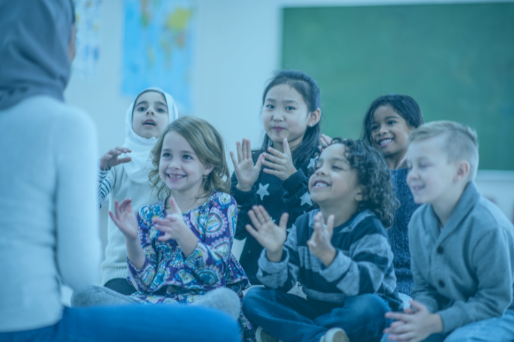 young-students-sitting-down-clapping-in-class