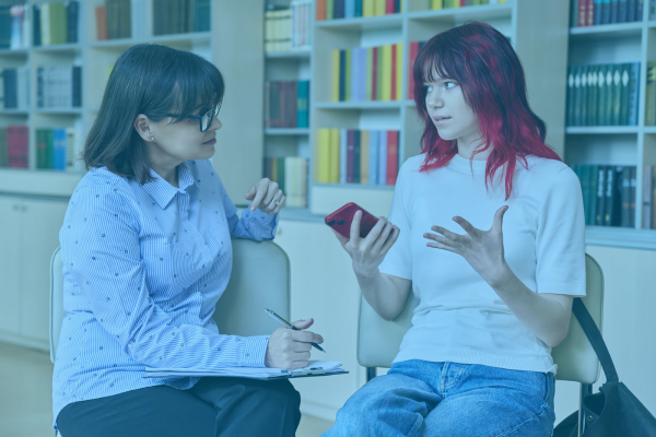 teacher talking to student individually about behavior