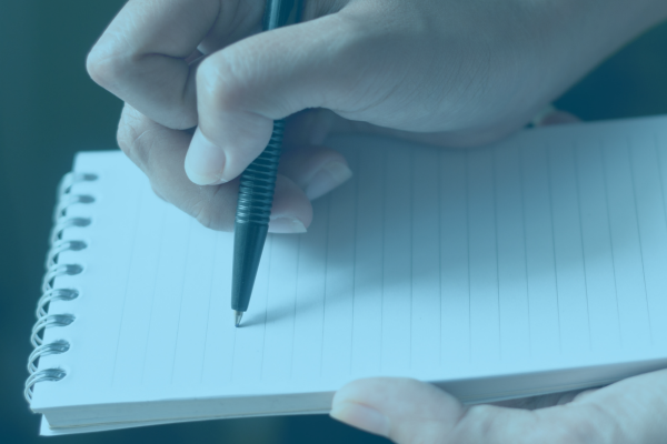 writing on a notepad